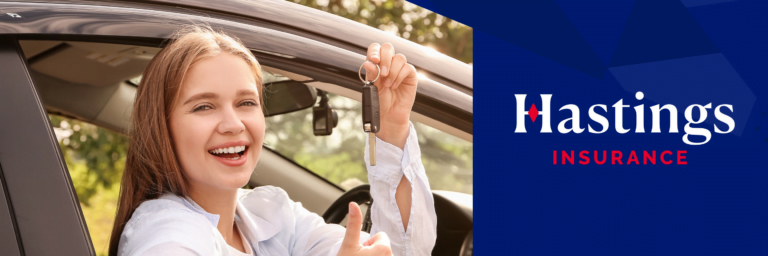 Young girl sitting in car holding car keys smiling, hastings Insurance logo